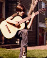 Elijah playing guitar, age 9